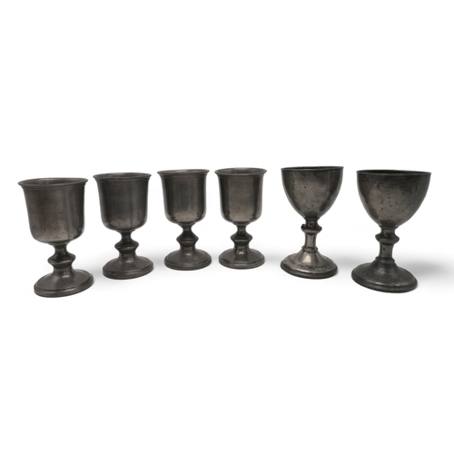 2260 - A COLLECTION OF CHURCH PEWTERincluding a pair of communion jugs, 32cm high,  a pair of goblets, 22cm... 