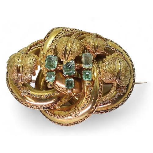 2809 - A VICTORIAN BROOCH the knot form with applied wire work details, is made in yellow metal and se... 