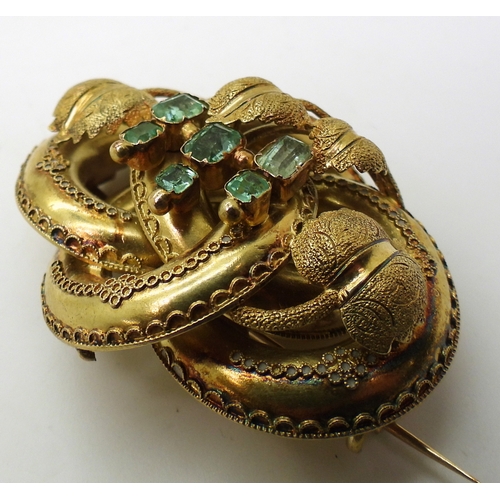 2809 - A VICTORIAN BROOCH the knot form with applied wire work details, is made in yellow metal and se... 