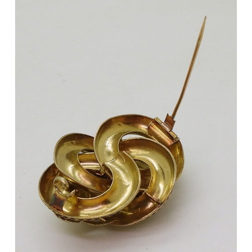 2809 - A VICTORIAN BROOCH the knot form with applied wire work details, is made in yellow metal and se... 