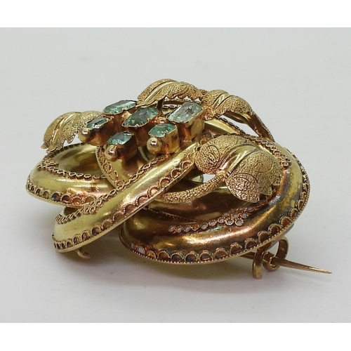 2809 - A VICTORIAN BROOCH the knot form with applied wire work details, is made in yellow metal and se... 