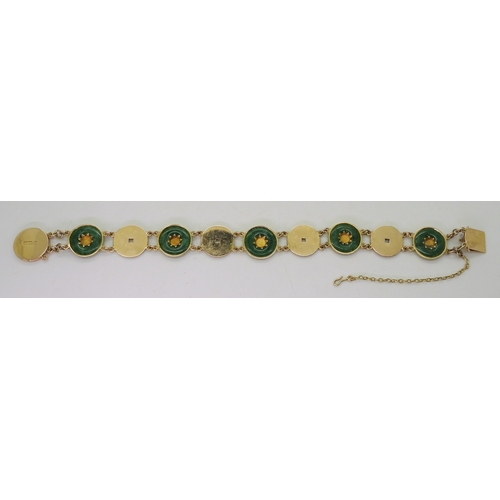 2814 - A CHINESE GREEN HARDSTONE BRACELETalternate rondels set with hardstone, with Chinese symbols through... 