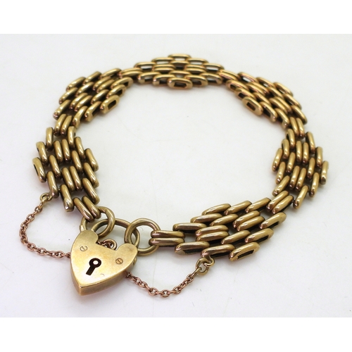 2815 - A 9CT GATE BRACELETwith decorative links and a heart shaped clasp, length 18.5cm, weight 15.8gms... 