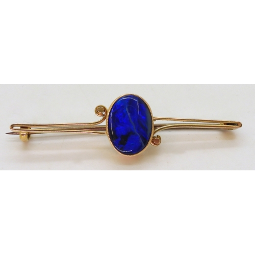 2818 - A BLACK OPAL BROOCHin a 15ct mount. The opal is approx 12mm x 9mm x3.5mm. Cobalt & teal colour f... 