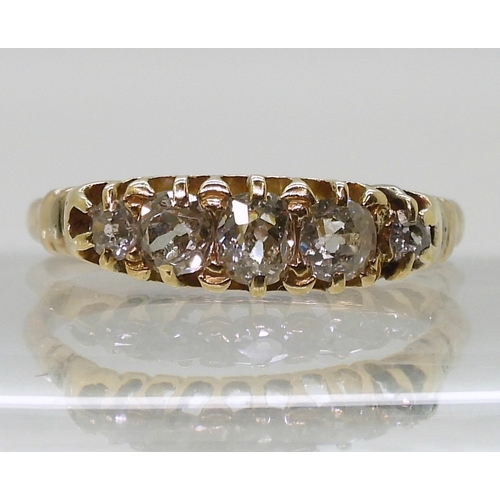 2825 - A FIVE STONE DIAMOND RINGset with estimated approximately 0.55cts of old cut diamonds in a yellow me... 