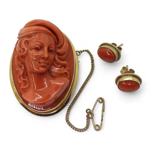 2826 - A CORAL CAMEO BROOCHthe well carved high relief cameo of a maiden is in a 18ct gold pendant brooch m... 