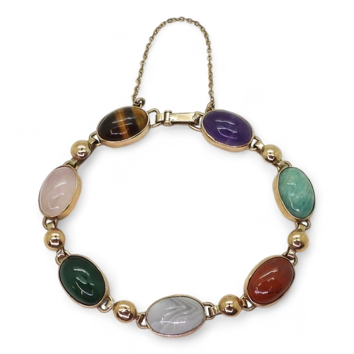 2830 - A MIXED GEMSTONE BRACELETin the Scottish style, set with a selection of semi precious gems to includ... 