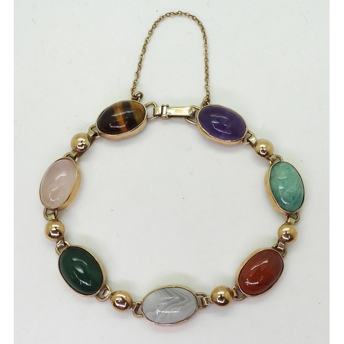 2830 - A MIXED GEMSTONE BRACELETin the Scottish style, set with a selection of semi precious gems to includ... 