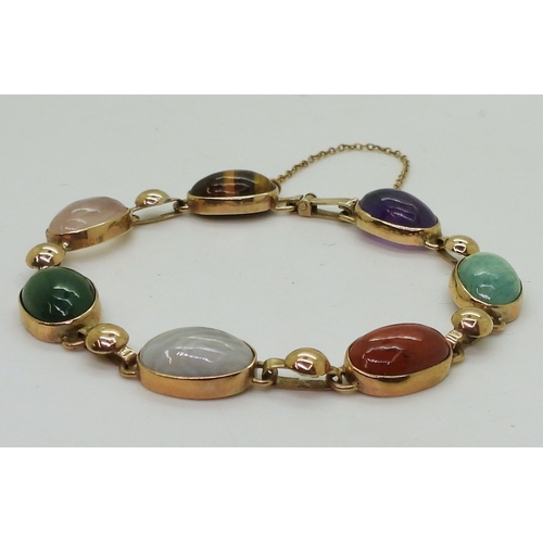 2830 - A MIXED GEMSTONE BRACELETin the Scottish style, set with a selection of semi precious gems to includ... 