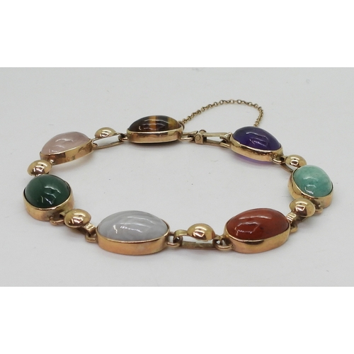 2830 - A MIXED GEMSTONE BRACELETin the Scottish style, set with a selection of semi precious gems to includ... 