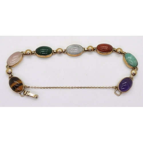 2830 - A MIXED GEMSTONE BRACELETin the Scottish style, set with a selection of semi precious gems to includ... 