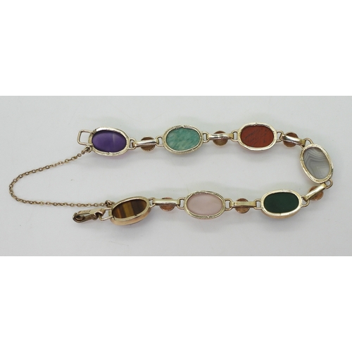 2830 - A MIXED GEMSTONE BRACELETin the Scottish style, set with a selection of semi precious gems to includ... 