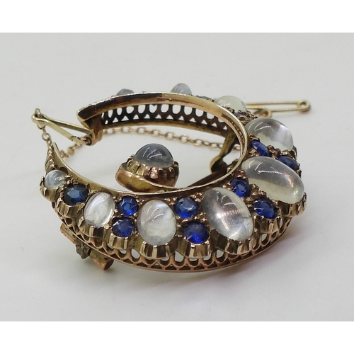 2831 - A CRESCENT BROOCHset with moonstone & blue paste to the yellow metal galleried mount, diameter a... 