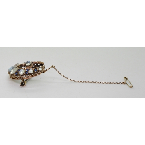 2831 - A CRESCENT BROOCHset with moonstone & blue paste to the yellow metal galleried mount, diameter a... 