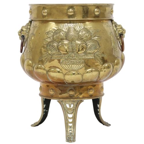 2013 - A DUTCH BRASS PLANTER with bulbous body embossed with armorial crest to one side and fruit/foliate m... 