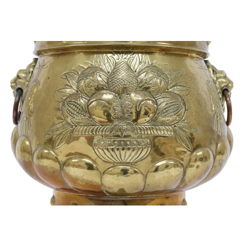 2013 - A DUTCH BRASS PLANTER with bulbous body embossed with armorial crest to one side and fruit/foliate m... 