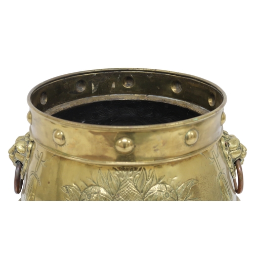 2013 - A DUTCH BRASS PLANTER with bulbous body embossed with armorial crest to one side and fruit/foliate m... 