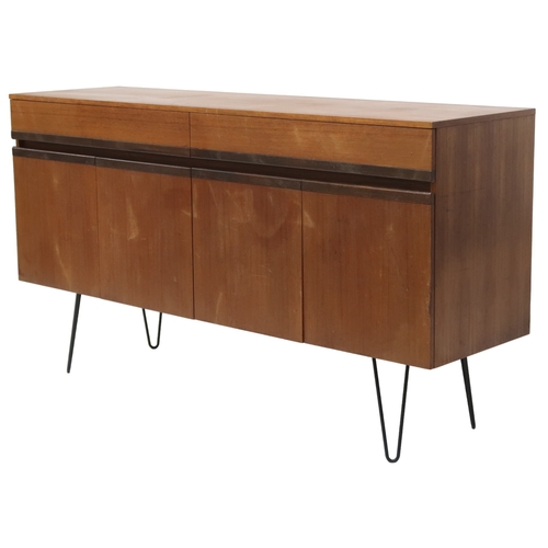 2076 - A MID 20TH CENTURY G PLAN SIDEBOARD with two long drawers over four cabinet doors on later hair... 