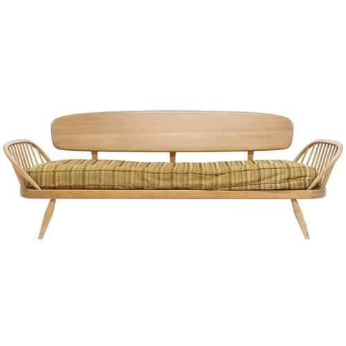 2078 - A MID 20TH CENTURY ERCOL BLONDE ELM AND BEECH DAY BED with removable back rest over upholstered cush... 