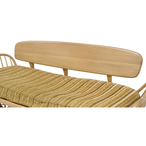 2078 - A MID 20TH CENTURY ERCOL BLONDE ELM AND BEECH DAY BED with removable back rest over upholstered cush... 