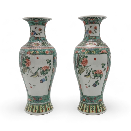 2400 - A PAIR OF CHINESE FAMILLE VERTE BALUSTER VASES painted with panels of flowers within bands of butter... 