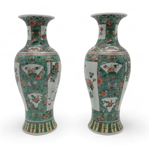 2400 - A PAIR OF CHINESE FAMILLE VERTE BALUSTER VASES painted with panels of flowers within bands of butter... 