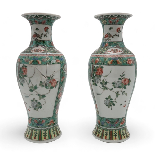 2400 - A PAIR OF CHINESE FAMILLE VERTE BALUSTER VASES painted with panels of flowers within bands of butter... 