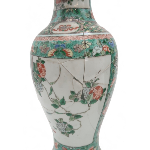 2400 - A PAIR OF CHINESE FAMILLE VERTE BALUSTER VASES painted with panels of flowers within bands of butter... 