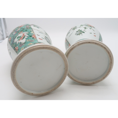 2400 - A PAIR OF CHINESE FAMILLE VERTE BALUSTER VASES painted with panels of flowers within bands of butter... 