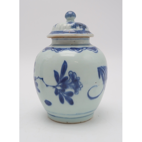 2401 - A CHINESE BLUE AND WHITE JAR AND COVERpainted with fruit, foliage and rockwork, 16.5cm high, blue an... 