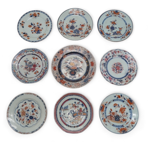 2402 - EIGHT VARIOUS CHINESE EXPORT IMARI PATTERN PLATESpainted with flowers, 22.5cm and 23cm diameter and ... 