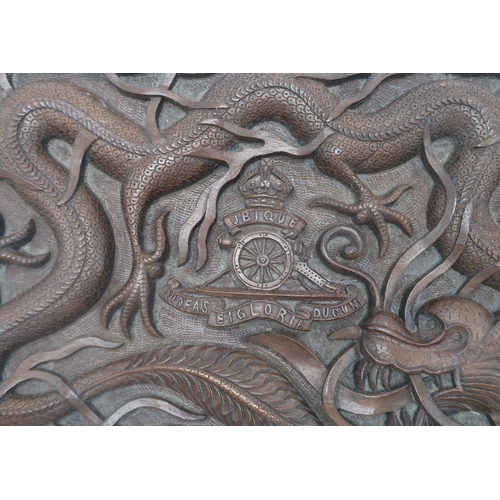 2406 -  A BURMESE MILITARY HARDWOOD CARVED CIGAR BOXwith Royal Artillery badge surrounded by dragons, the i... 