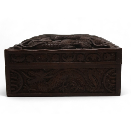 2406 -  A BURMESE MILITARY HARDWOOD CARVED CIGAR BOXwith Royal Artillery badge surrounded by dragons, the i... 