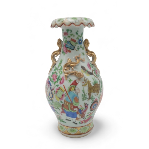 2409 - A CANTON BALUSTER VASE painted with various figures, animals, precious objects and applied with gilt... 