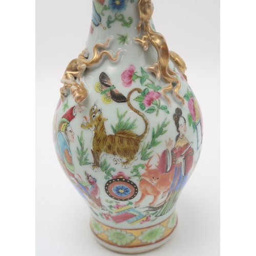 2409 - A CANTON BALUSTER VASE painted with various figures, animals, precious objects and applied with gilt... 