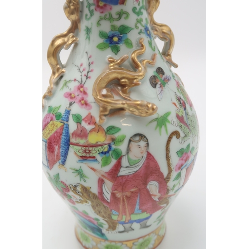 2409 - A CANTON BALUSTER VASE painted with various figures, animals, precious objects and applied with gilt... 