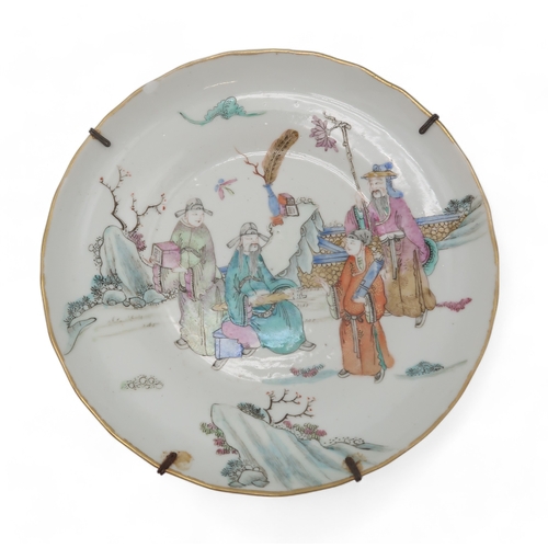 2410 - A CHINESE DISH AND TWO PLATESthe dish painted with officials, 18.5cm diameter, a plate with mountain... 