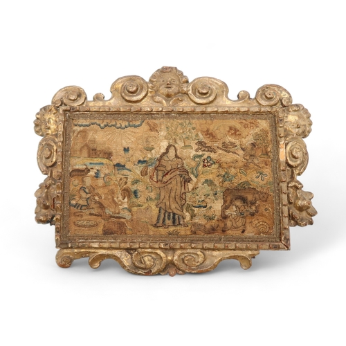 2663 - A 17th/18th CENTURY NEEDLEWORK PANELDepicting a robed figure within an abundant landscape, with a fl... 