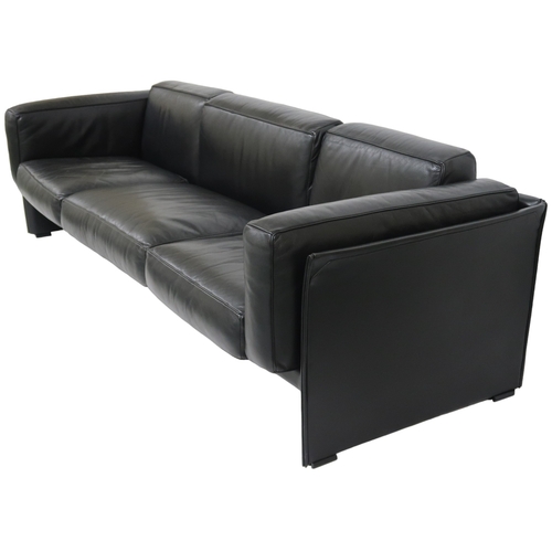 2084 - A 20TH CENTURY CASSINA THREE SEATER SETTEEwith black leather upholstered cushions on leather upholst... 