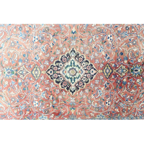 2123 - A TERRACOTTA GROUND FULL PILE PERSIAN SUROK RUNNER with dark central medallion and light blue s... 