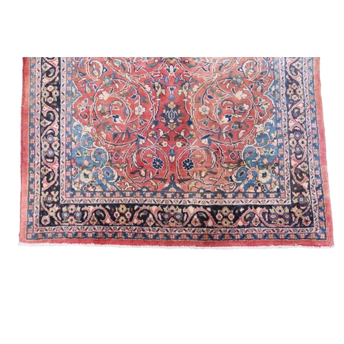 2123 - A TERRACOTTA GROUND FULL PILE PERSIAN SUROK RUNNER with dark central medallion and light blue s... 