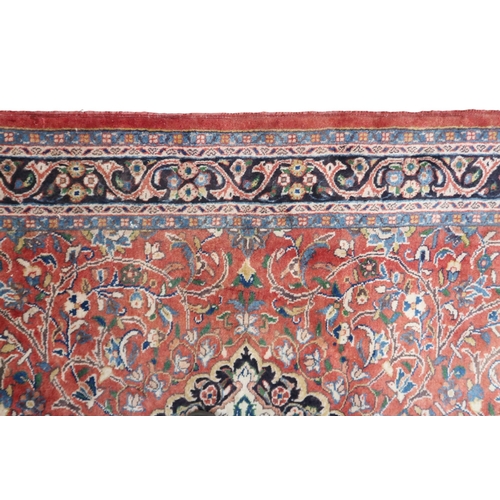 2123 - A TERRACOTTA GROUND FULL PILE PERSIAN SUROK RUNNER with dark central medallion and light blue s... 