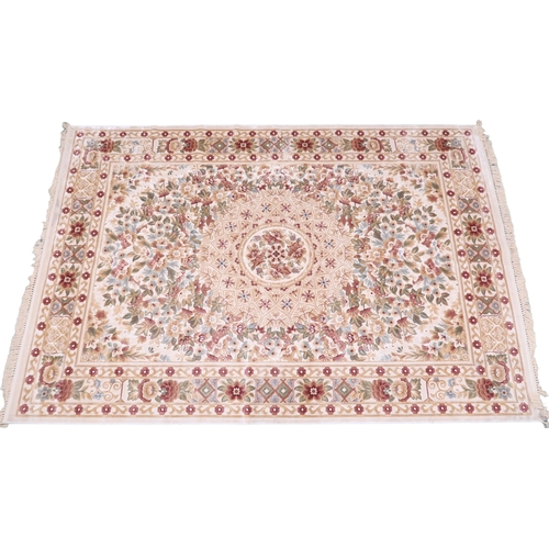 2127 - A CREAM GROUND FULL PILE ORBISON DESIGN RUG with circular central medallion on floral patterned... 