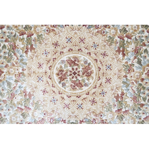 2127 - A CREAM GROUND FULL PILE ORBISON DESIGN RUG with circular central medallion on floral patterned... 