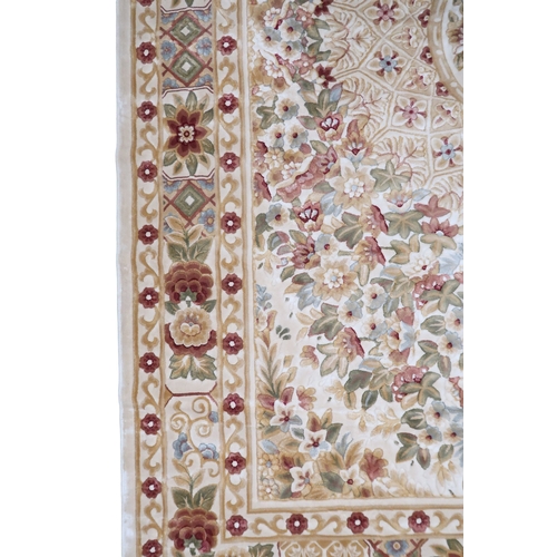 2127 - A CREAM GROUND FULL PILE ORBISON DESIGN RUG with circular central medallion on floral patterned... 