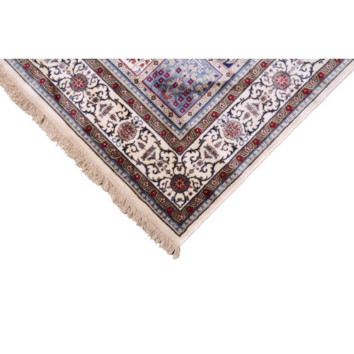 2129 - AN IVORY GROUND FULL PILE PERSIAN STYLE RUG  with multicoloured panel design within cream flora... 