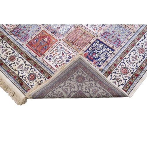 2129 - AN IVORY GROUND FULL PILE PERSIAN STYLE RUG  with multicoloured panel design within cream flora... 