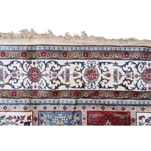 2129 - AN IVORY GROUND FULL PILE PERSIAN STYLE RUG  with multicoloured panel design within cream flora... 