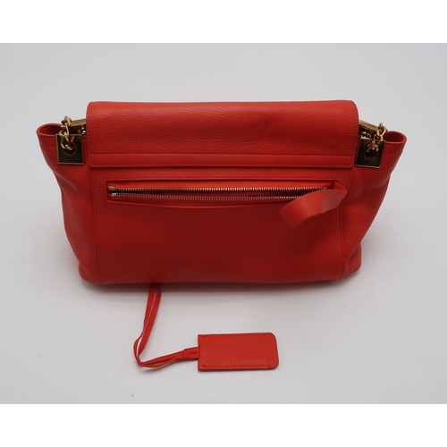 2674 - A LANVIN PARTITION SHOULDER BAGin orange leather, lined in red fabric, with two open pockets under t... 