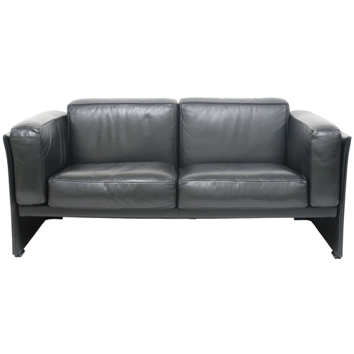 2085 - A 20TH CENTURY CASSINA TWO SEATER SETTEEwith black leather upholstered cushions on leather upholster... 